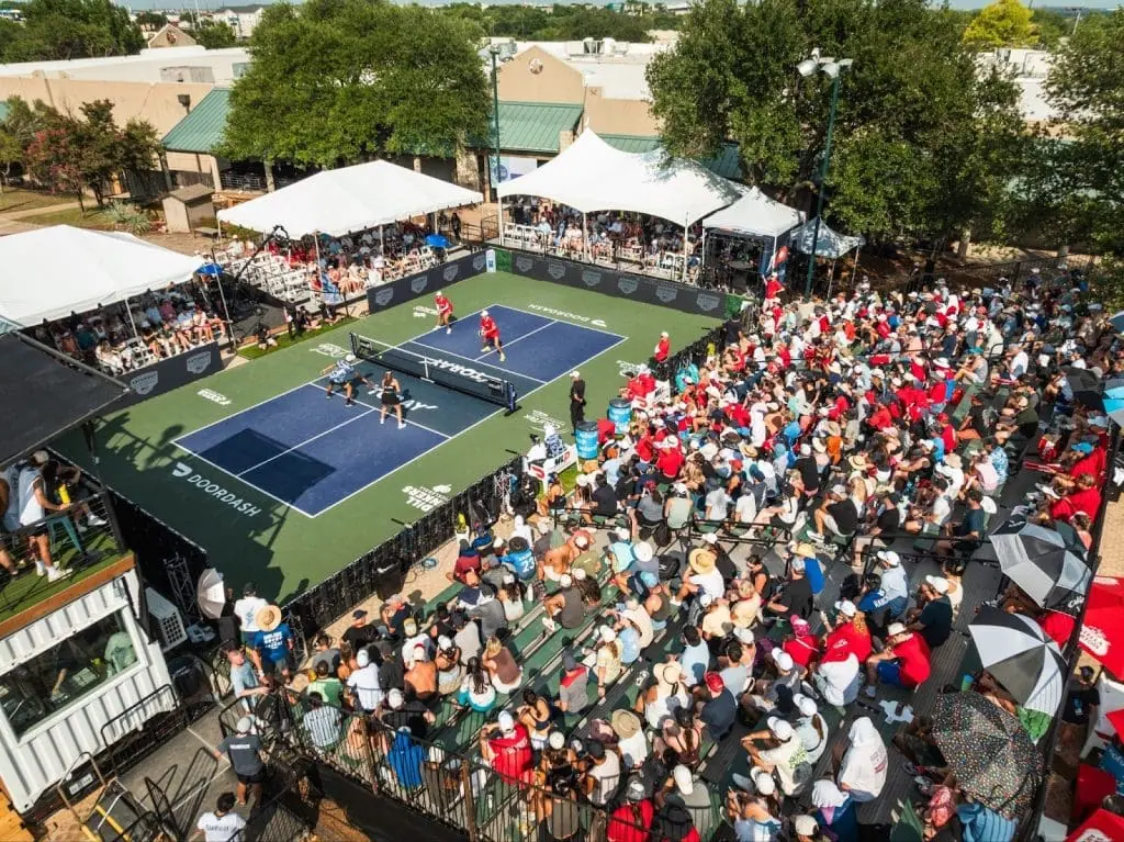Exciting Major League Pickleball match with large crowd and vibrant atmosphere.