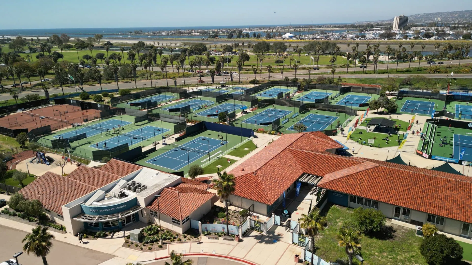 Aerial view of Major League Pickleball courts with multiple tennis-style courts and amenities.