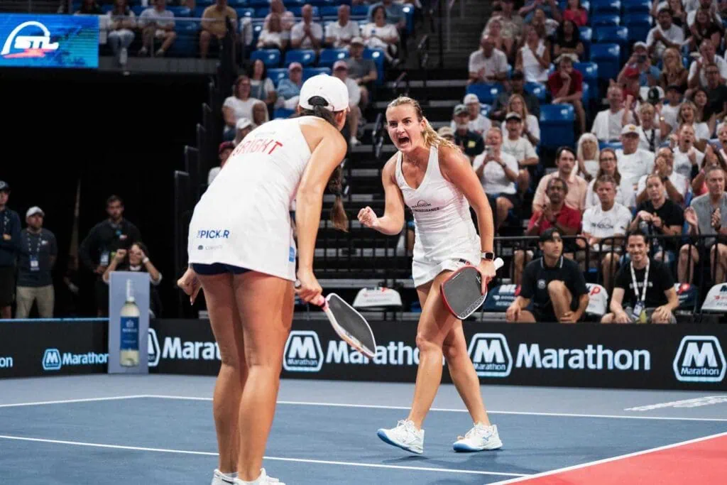 Pickleball players celebrating during a match at Major League Pickleball.