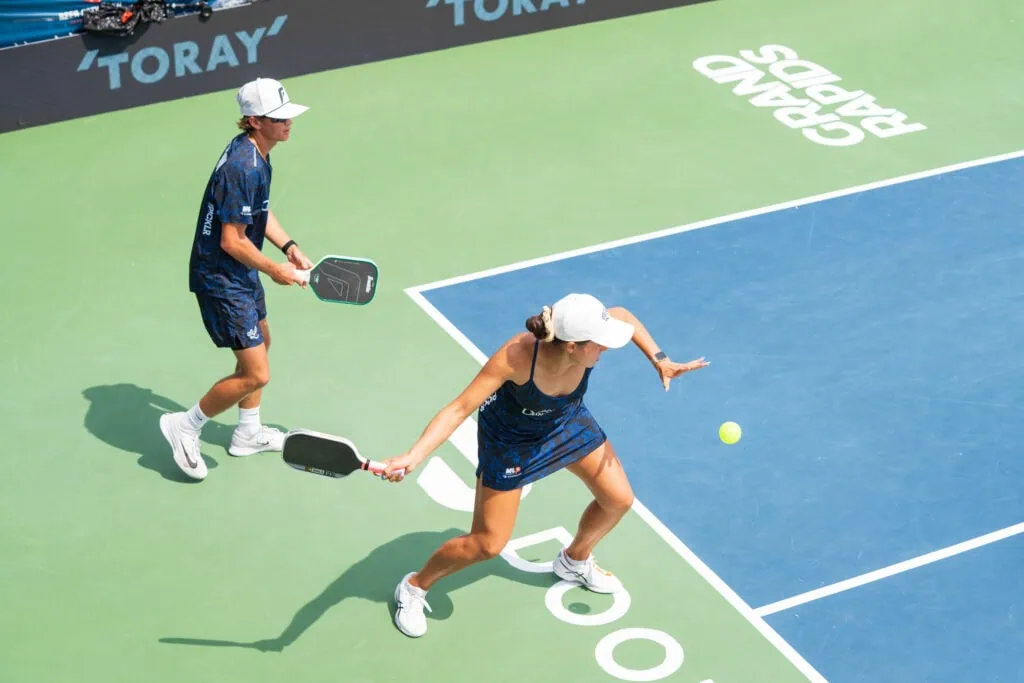 Female pickleball players in action during a match at Major League Pickleball.
