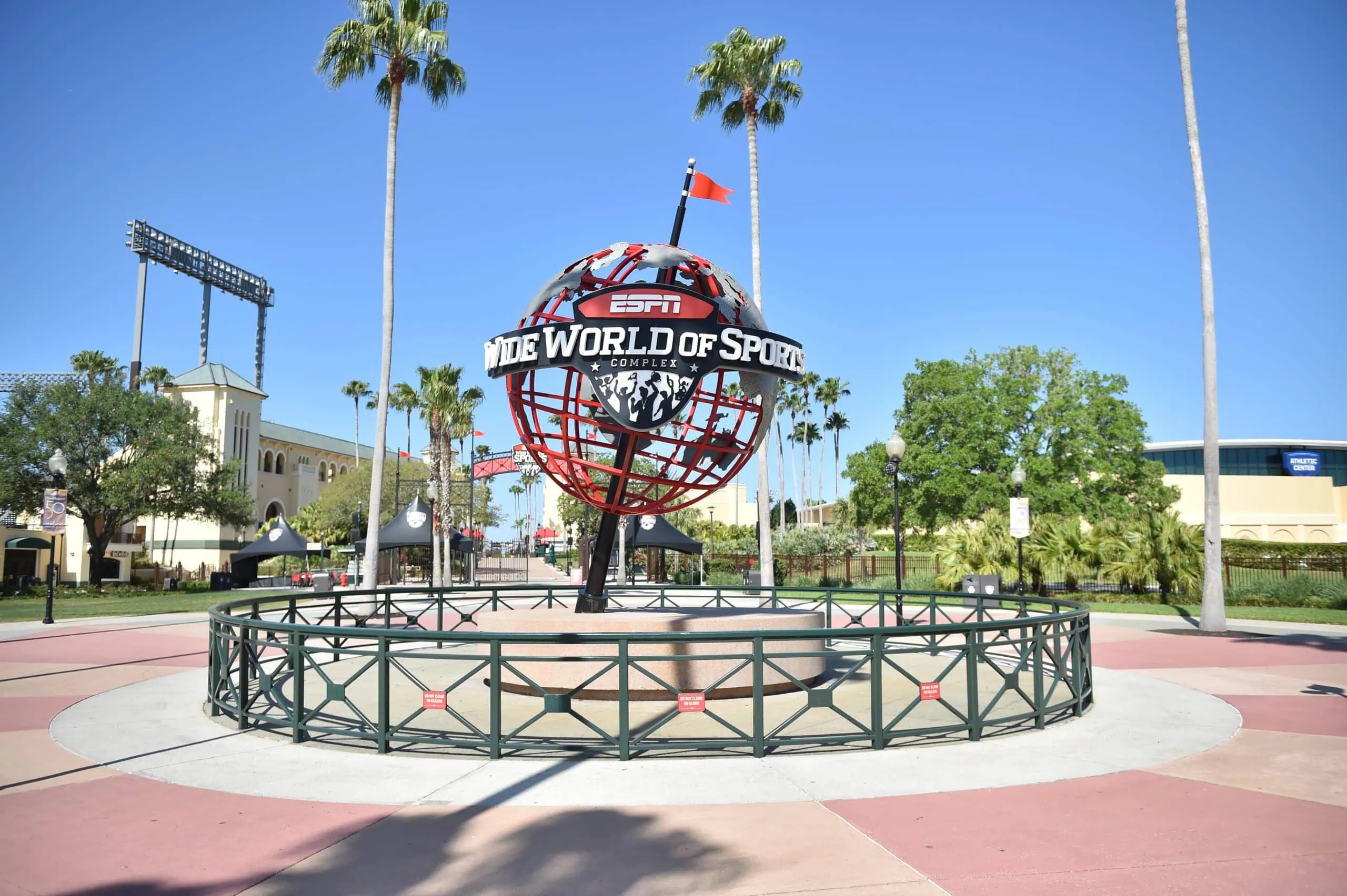 Major League Pickleball globe sign at the entrance with palm trees in the background.