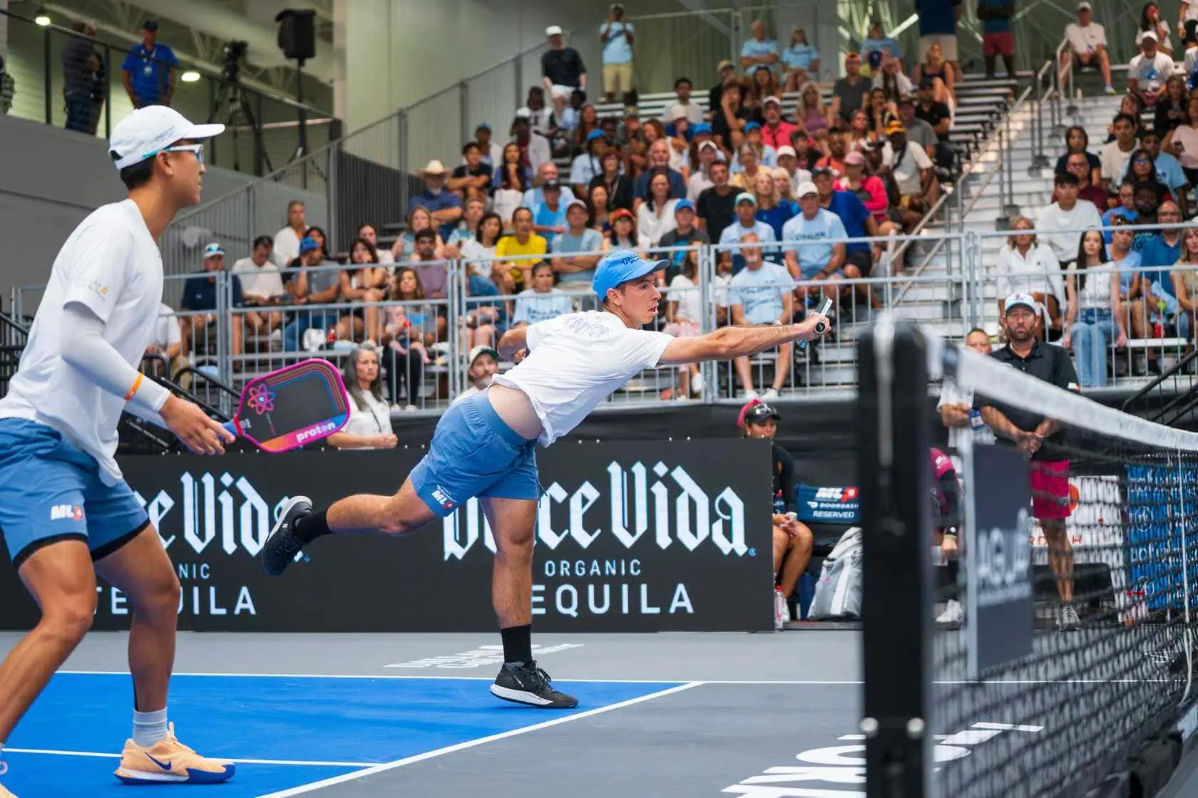 Pickleball player diving to hit the ball during a match at Major League Pickleball.
