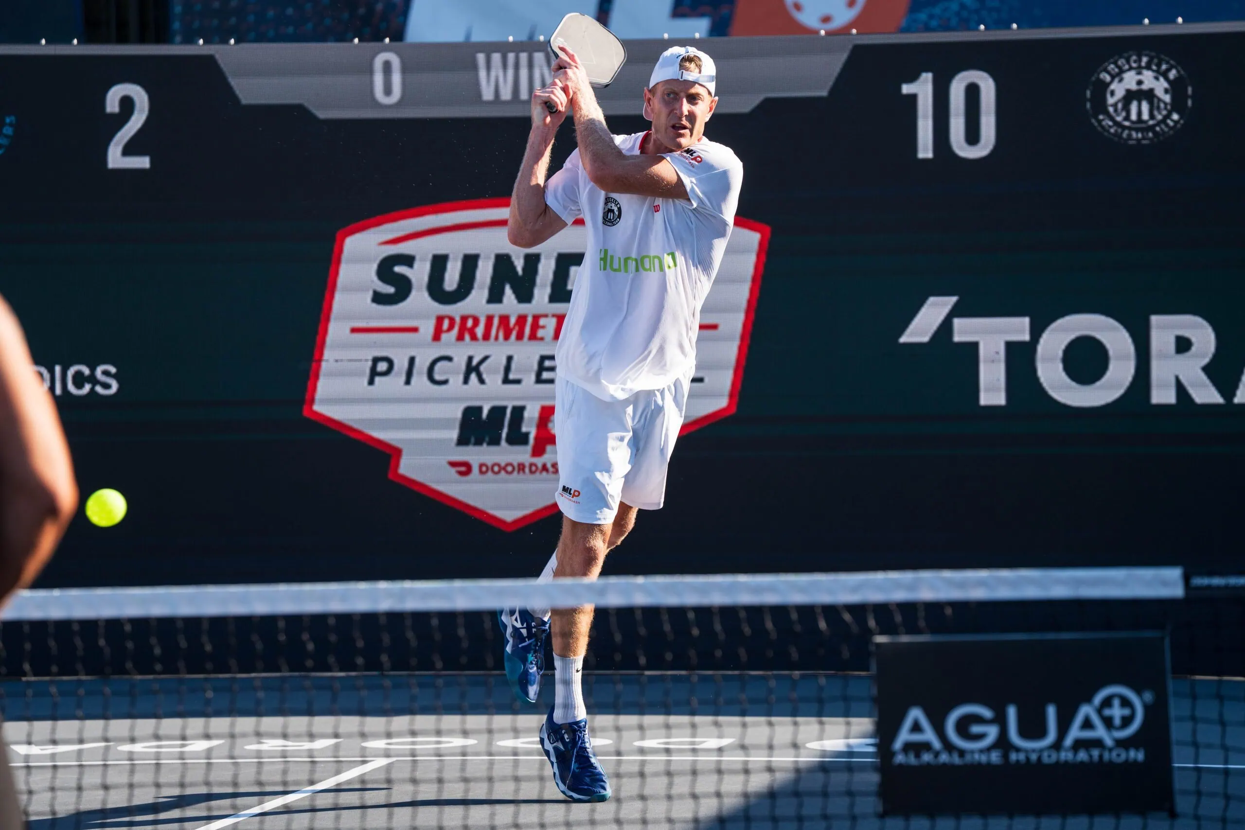 Pickleball player preparing to serve during a Major League Pickleball match.