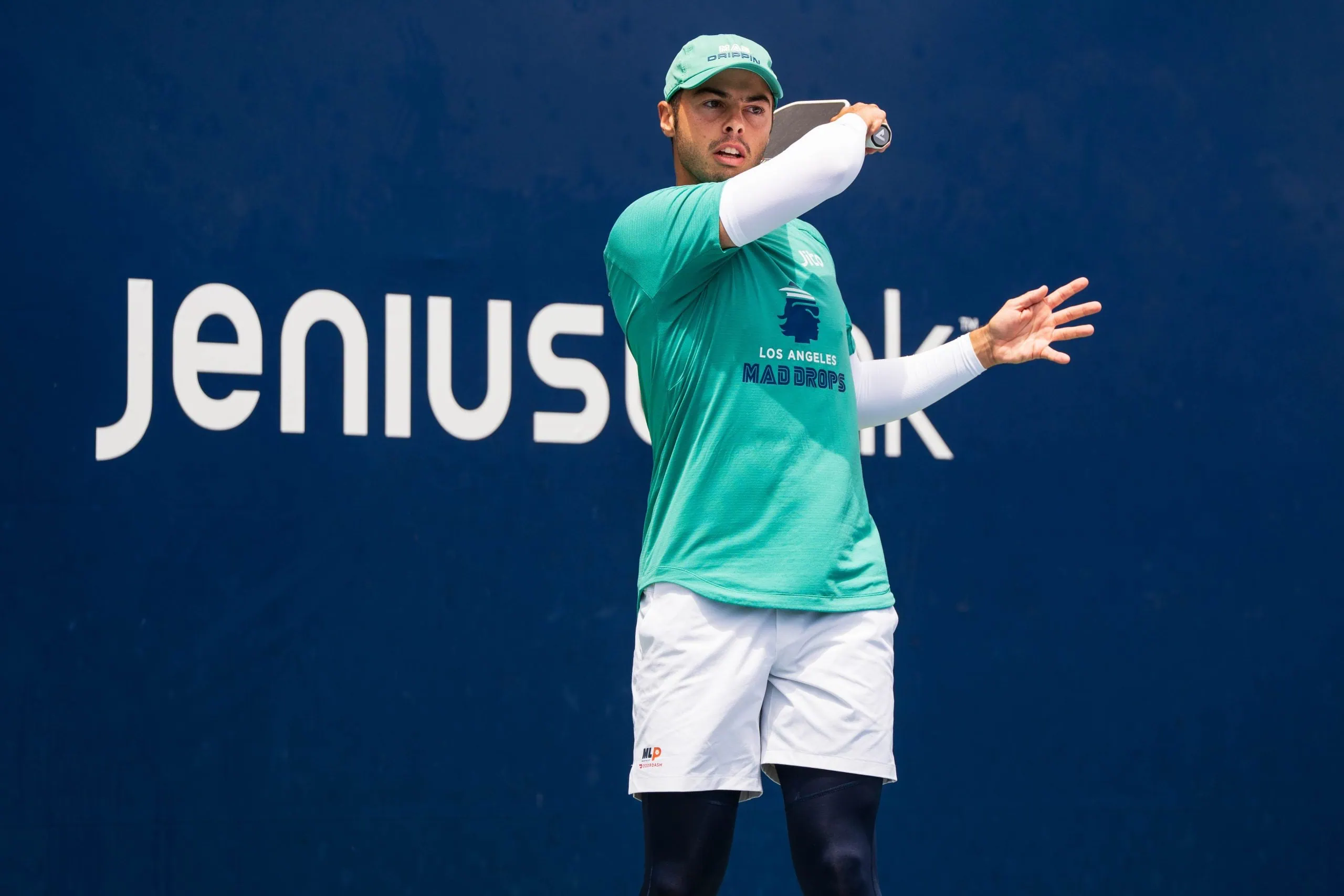 Pickleball player in action at Major League Pickleball event.