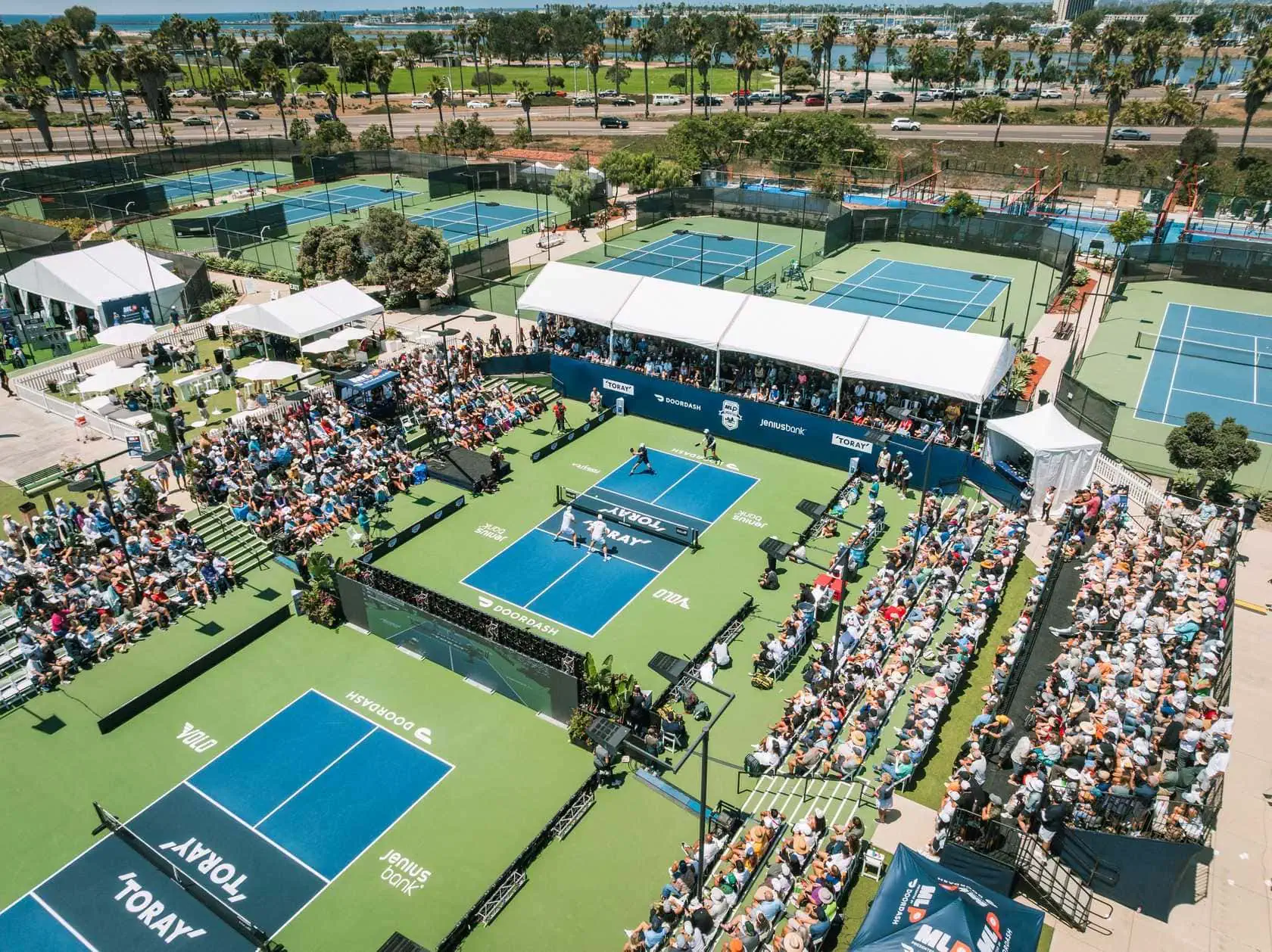 Pickleball court at Major League Pickleball event with spectators.