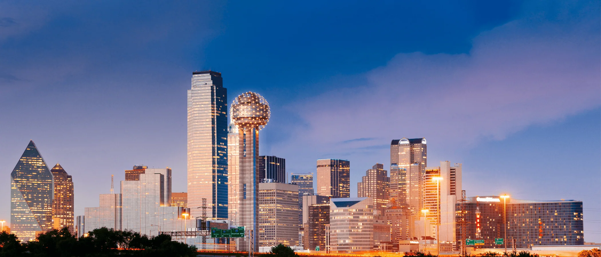 Vibrant Dallas skyline with players competing in a Major League Pickleball match at sunset.